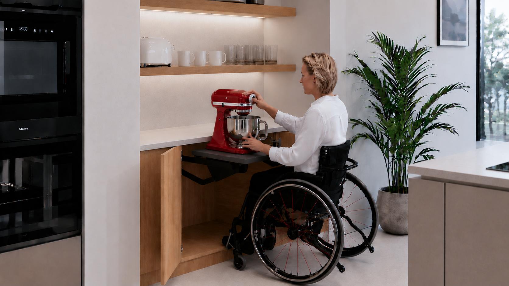 Accessible kitchen using concealed power, an appliance lift and flexible work surfaces
