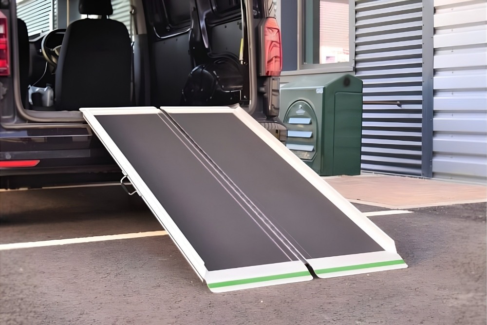 Modular external wheelchair ramp with handrails leading to a home entrance